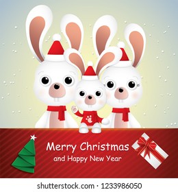 Cute cartoon,white rabbits family and gift card in snow for winter season.