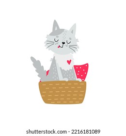 Un gato lindo en la canasta. Pequeño gatito gracioso sentado en una acogedora cesta de mimbre con almohada roja. Feliz gatito que va a dormir. Mascota de caricatura, ilustración de vector dibujada a mano para niños, aislado. Diseño plano