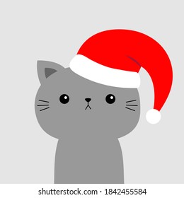 Cute cat face in red Santa hat. Merry Christmas. Funny kawaii doodle baby animal. Cute cartoon funny character. Kitten kitty. Pet collection. Flat design. White background. Vector illustration