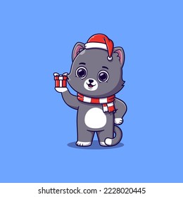 cute cat holding small christmas gift