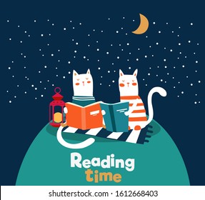 Cute cat reads a book under the tree. Funny animal relaxing in park