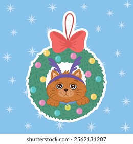 A cute cat wearing a Christmas wreath, a pet playing with Christmas decorations, on a blue background.Merry Christmas and Happy New Year greeting card. The Mascot