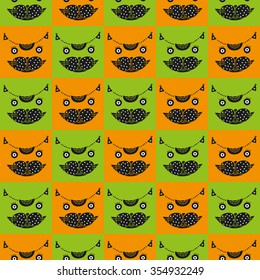 Cute cat's head seamless checkered pattern. Vector illustration