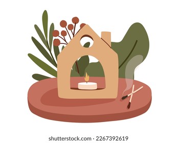Cute ceramic candle holder with tea candle in it surrounded by greenery