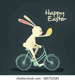 Cute cheerful Bunny holding an egg and riding bicycle on occasion of Happy Easter celebration.