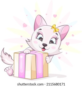 Cute and cheerful kitten with a bow holds a gift