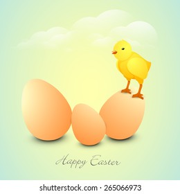 Cute chick standing on a egg for Happy Easter celebration on shiny cloudy background.