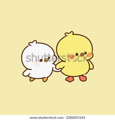 Cute chicks walking hand in hand