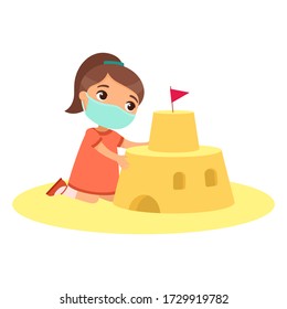 Cute child building sand castle with a face mask. Virus protection, allergies consept. Funny kid playing on beach cartoon character. Little girl constructing sandy fortress. Summer recreation activity