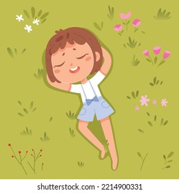 Cute child lying on green grass of summer park with lawn or playground, top view vector illustration. Cartoon girl sleeping, funny child relaxing among plants and flowers during picnic background