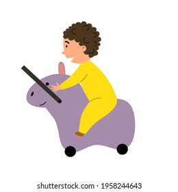 A cute child went on a trip on a children is suitcase-toy.
