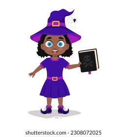 Cute child in a witch costume holding a book