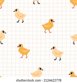 Cute childish seamless pattern with yellow chick on a checkered background. Cartoon vector illustration. Nursery Print for textiles and paper.