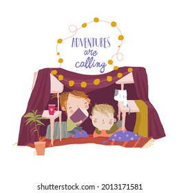 Cute Children sitting and reading a Book in a Homemade Teepee