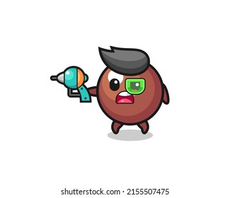 cute chocolate ball holding a future gun , cute design