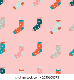 Cute Christmas background. Cartoon Christmas socks with stars seamless pattern. Traditional winter patterns for holidays. Vector illustration of doodle socks for gifts. Packaging design, postcards.