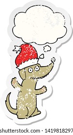 cute christmas cartoon dog with thought bubble as a distressed worn sticker