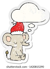 cute christmas elephant with thought bubble as a distressed worn sticker