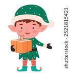 Cute christmas elf holding present decorated with bow. Happy cute little boy wearing green elf christmas costume