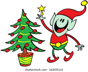 Cute Christmas elf standing on tiptoes while putting a yellow star at the top of the Christmas tree as a final decorative touch