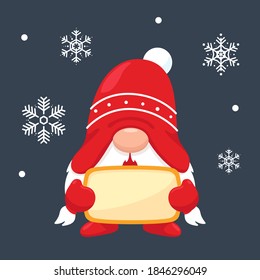 A cute christmas gnome holding a blank label for a message. On the background snowflakes falling in winter