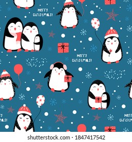 Cute christmas pattern with penguins. Seamless vector children`s background.  Christmas motives. Printing on paper, textile, fabric, wallpaper.