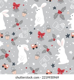 Cute Christmas pattern with white rabbits, Christmas bells and toys. Seamless vector pattern.