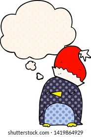 cute christmas penguin with thought bubble in comic book style
