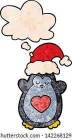 pingüino de navidad adorable con burbuja de pensamiento al estilo de textura gruesa