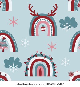 Cute christmas rainbows seamless pattern with decorative rainbows, clouds, snowflakes, antlers, xmas lights on light bue background. Hand drawn flat vector illustration.