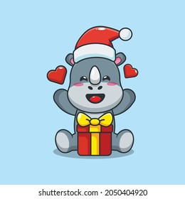 Cute christmas rhino cartoon vector illustration