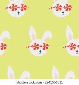 cute christmas seamless pattern with bunny with glasses and candy
