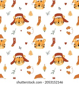 Cute Christmas seamless pattern. Image of winter clothes, New Year's tigers, hearts. White background. Vector illustration.