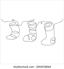 Cute Christmas socks drawn and one line  Holiday sketch  Christmas decoration  Continuous line drawing art  Minimal style  Vector illustration 