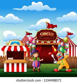 Cute a clown and a girl on the circus entrance