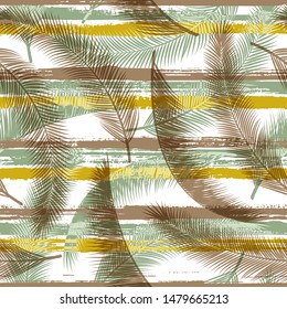 Cute coconut palm leaves tree branches over painted stripes seamless pattern design. Hawaiian forest foliage clothing fabric print. Tropical leaves and stripes seamless.