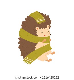 Cute colorful hedgehog wrapping in warm cozy scarf vector flat illustration. Adorable forest animal warming sitting isolated on white. Joyful wild childish character enjoying autumn season