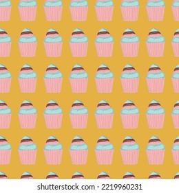 Cute colorful pink and blue cupcakes on yellow background seamless textile graphic design, dessert 