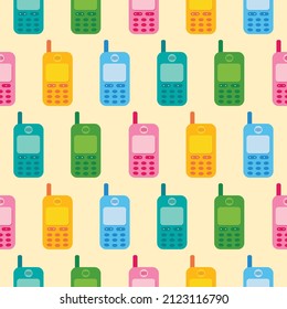 Cute and colorful retro mobile phones vector seamless pattern background.

