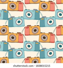 Cute colorful seamless vector pattern of decorative vintage lined photo cameras in pastel colors. The design is perfect for backgrounds, textiles, wrapping paper, packaging, advertisements.