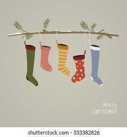 Cute colorful socks hanging on strings on a branch covered with snow. Christmas retro card template in flat design in vector.