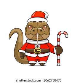 Cute and cute comodo dragon mascot, holding candy cane, wearing santa claus costume, cartoon animal character with sparkling eyes, front view. kawaii styles, flats, for kids and adults, for stickers. 