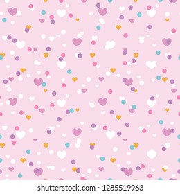 Cute confetti hearts seamless repeat pattern. Great for Valentines Day or wedding invitations, cards, backgrounds, gifts, packaging design projects. Surface pattern design.