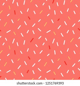 Cute coral seamless pattern background with doodle style confetti, sprinkles for holiday, party design.