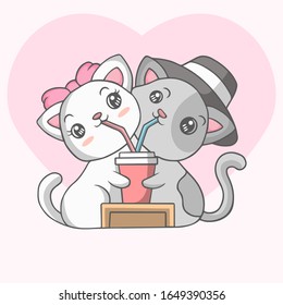 Cute couple cats drinking together