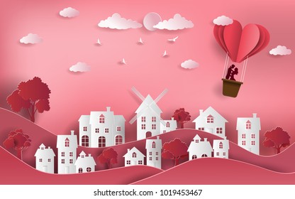 Cute couple in love hugging, staring at each other's eyes and standing inside a basket of an air balloon, paper art style, flat-style vector illustration.