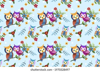 Cute couple owl on branch with flowers seamless pattern.