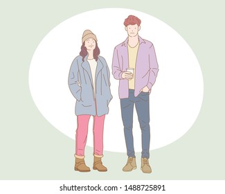 Cute Couple of young people. Man and woman standing so smart  hand drawn style vector doodle design illustrations.