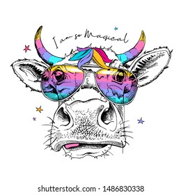 Cute cow in a rainbow glasses with a unicorn horns. I am so magical - lettering quote. Humor card, t-shirt composition, hand drawn style print. Vector illustration.