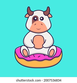 Cute cow is sitting on donuts. Animal cartoon concept isolated. Can used for t-shirt, greeting card, invitation card or mascot.